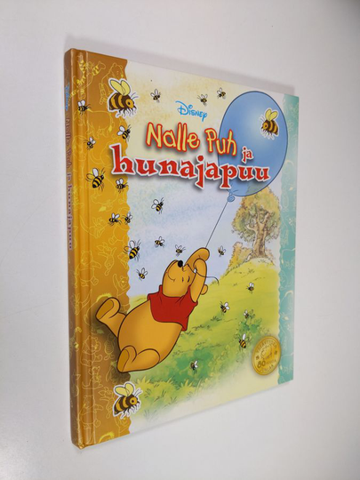 Nalle Puh ja hunajapuu : herttainen tarina Puolen hehtaarin metsästä